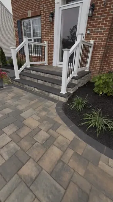Paver walk wrapping the front steps