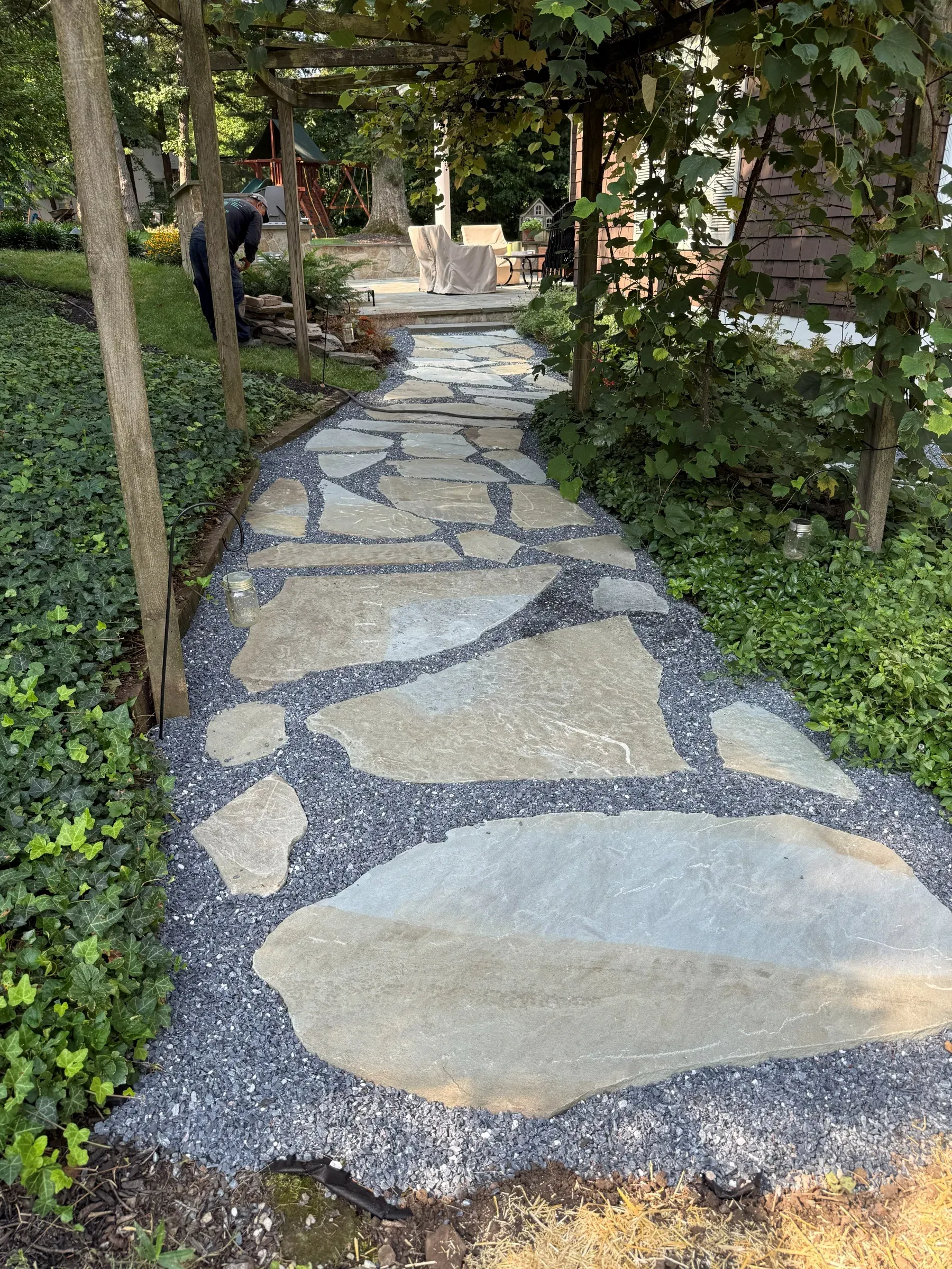 Flagstone path through a shaded garden