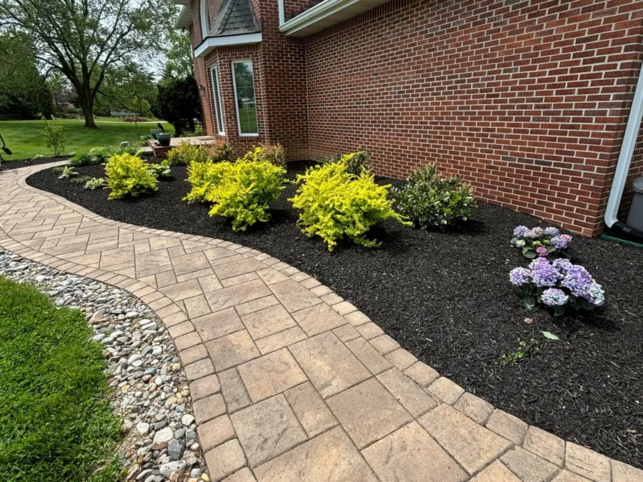 Paver walk with a river-rock border